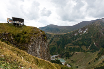 Fototapeta premium Panoramic view on Jinvali Water Reservoir blue lake in Caucasian Mountain autumn. Gudauri District