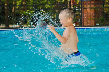 child is playing in the children's pool