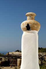 Greek rural chimney on the blue sky