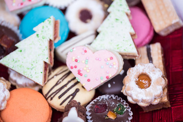 Traditional celebration festive homemade decorated sweets on wooden background