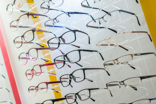a variety of medical and sunglasses on the stand in the store