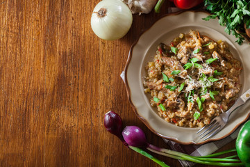 Risotto with champignon mushrooms, pork and parmesan