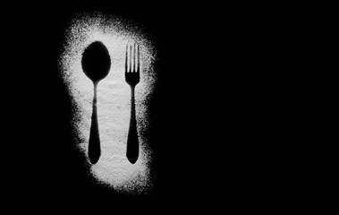 Spices on table with cutlery silhouette