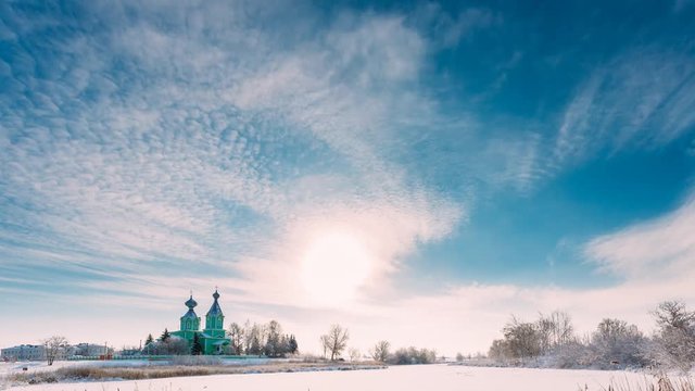 Village Krupets, Dobrush District, Gomel Region, Belarus. Time Lapse Timelapse Time-lapse Of Old Wooden Orthodox Church Of The Holy Trinity Sunny Winter Day. Historical Heritage