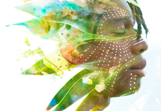 Paintography. Double exposure of a dark skinned man with dreadlocks and closed eyes combined with a photograph of a beautiful lush plants and hand drawn watercolor painting