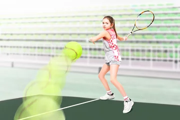Fotobehang Portrait of a young beautiful girl tennis player on the background stadium © sonsedskaya