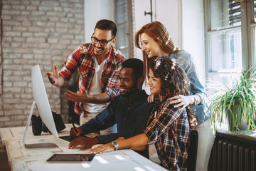 Young group of designers negotiates about design