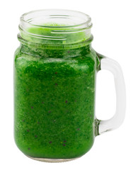 Healthy green smoothie with straw in a jar mug isolated on white