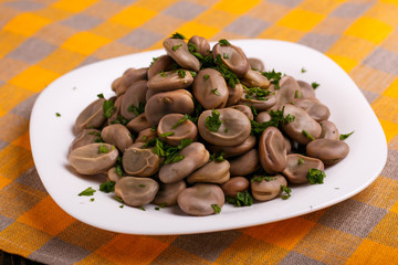 boiled broad beans on a rustic background
