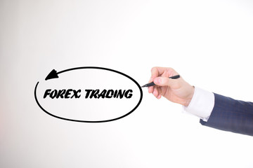 The businessman writes a black marker inscription:FOREX TRADING