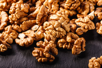 Walnut on a dark rustic wooden background