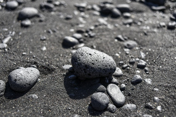 Black pebbles on a black beach on Lanzarote, Canary Islands.