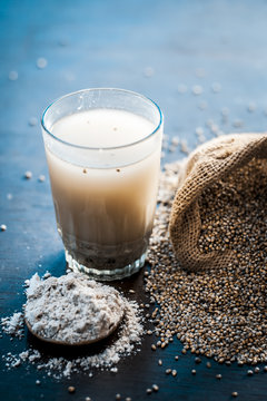 Close up of popular summer drink i.e. Barley kanji in glass with all its ingredients on a wooden surface isolated on a white surface.;