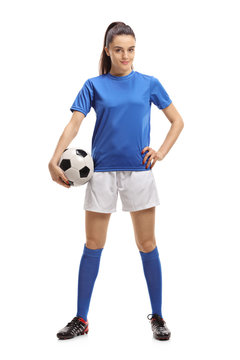 Fototapeta Female soccer player with a football