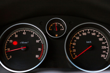 Modern car dashboard to help the driver. Tachometer, speedometer and fuel level sensor with illuminated pointer and number for ease control car in way. Transport technologies in mechanical engineering