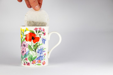 Teabag being Placed in Mug