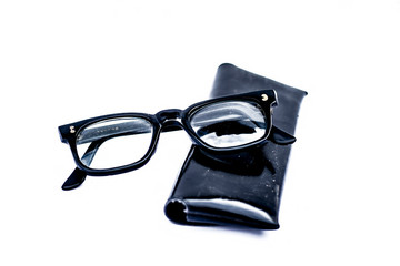 Close up of black full rim frame reading spectacles isolated on a white.