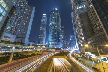 Fototapeta na wymiar Traffic and skyscraper in midtown of Hong Kong city at night