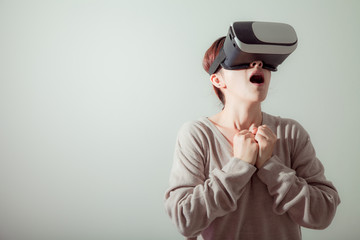 VR or Virtual reality helmet is future technology concept . Woman using  VR glasses with computer technology that simulates a physical presence Photorealistic 3D And enjoys watching movies.