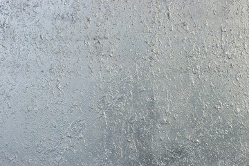 Silver wall background. Gray rough sprayed wall texture.