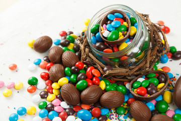 Fototapeta na wymiar Chocolate eggs and glaze color candy