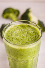 fresh broccoli juice on a wooden background
