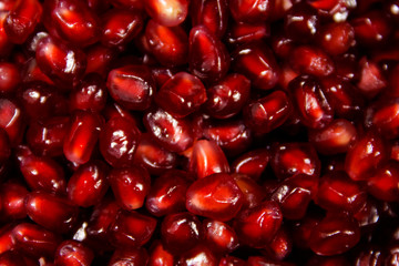 Food background of the fresh ripe pomegranate seeds