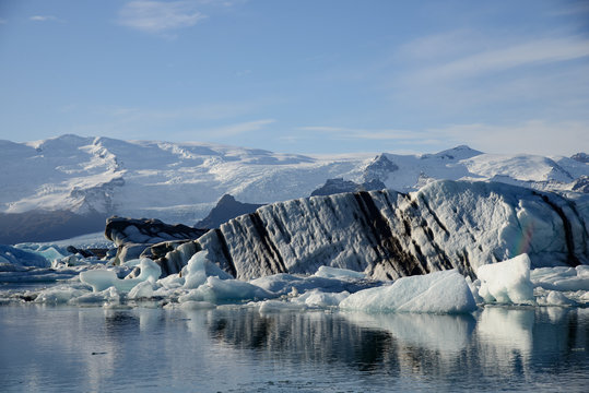the glacier lagoon Jökulsarlon in Iceland with floating icebergs.