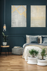Navy blue bedroom with art
