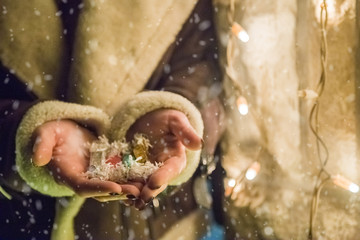 Close up of Christmas candy in female hands. Holidays concept