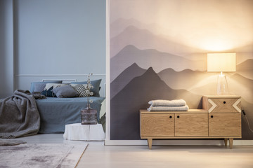 Table lamp on wooden cabinet