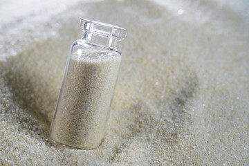 Desert liquor fine sand trickles into a champagne glass 
