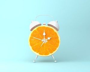 Creative idea layout fresh orange slice alarm clock on pastel blue background. minimal idea...