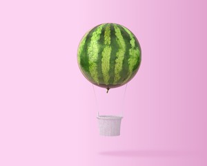 Big hot air balloon watermelon concept on pastel pink background with copy space for text. happy...
