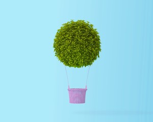 Hot air balloon green bush,grass, idea concept on pastel blue background with copy space for text. happy holiday flying balloons. Minimal creative concept.