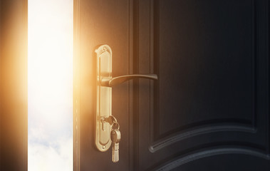 Open wooden doors with sky background