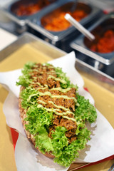 Delicious pulled pork sandwich with dressing
