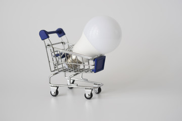 Lightbulb on shopping cart.