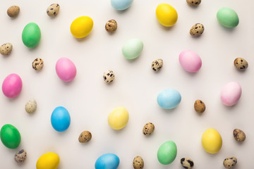 Easter background. Colored eggs on white, isolated