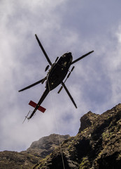 Fototapeta na wymiar Rescue Helicopter over Barranco de Masca, gorge, Teno Massif, Tenerife Island, Canary Islands, Spain