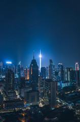 Cityscape of Kuala Lumpur city skyline at night in Malaysia.