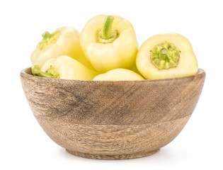 White paprika (Hungarian sweet peppers) in a wood bowl isolated on white background.
