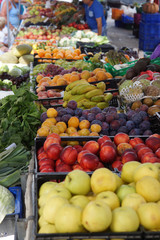 A lot of different fruits on the counter in the market in Spain