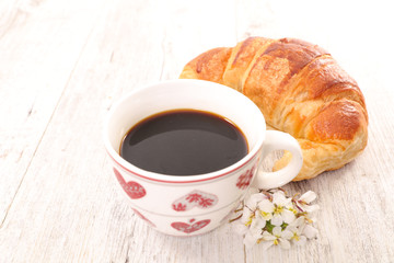 coffee cup and croissant