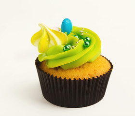 Tasty muffin with buttercream isolated on white