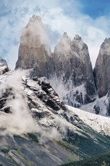 Fototapeta na wymiar Torres del Paine peaks coming from clouds