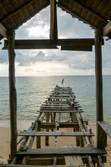 Old pier at Sunset beach of Koh Rong Sanloem island