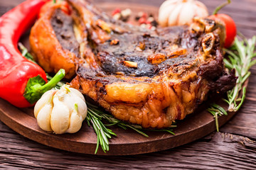 Tasty beef steak with spices and vegetables close