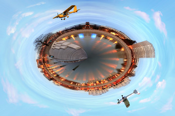 Panorama 360 stopni wierzowca, samoloty, oświetlenie nocą, w stylu mini planety.