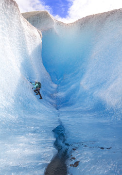 Woman climbing Mendenhall Glacier